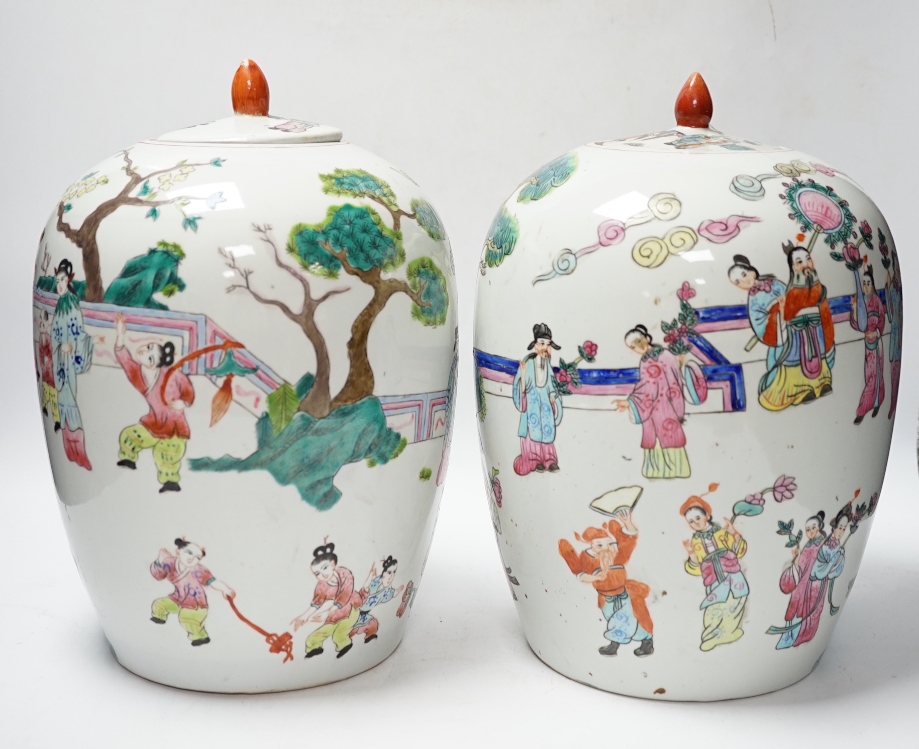 A pair of Chinese famille rose ovoid jar and covers, 32cm high